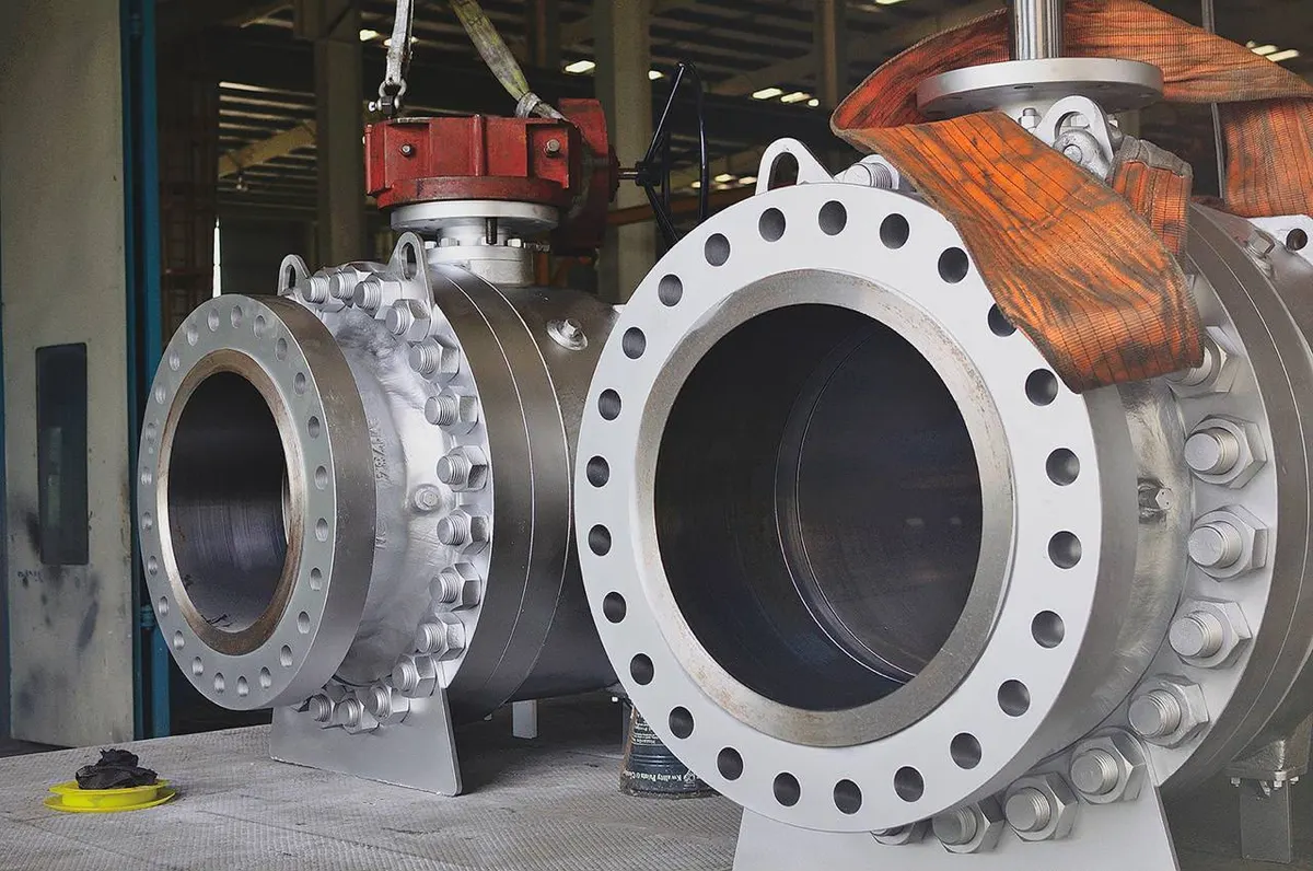 Trunnion-mounted ball valves being lifted